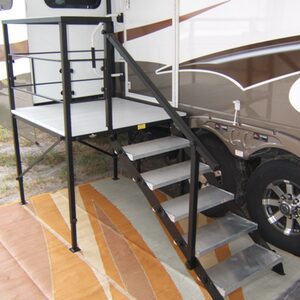 A car parked next to a metal staircase.